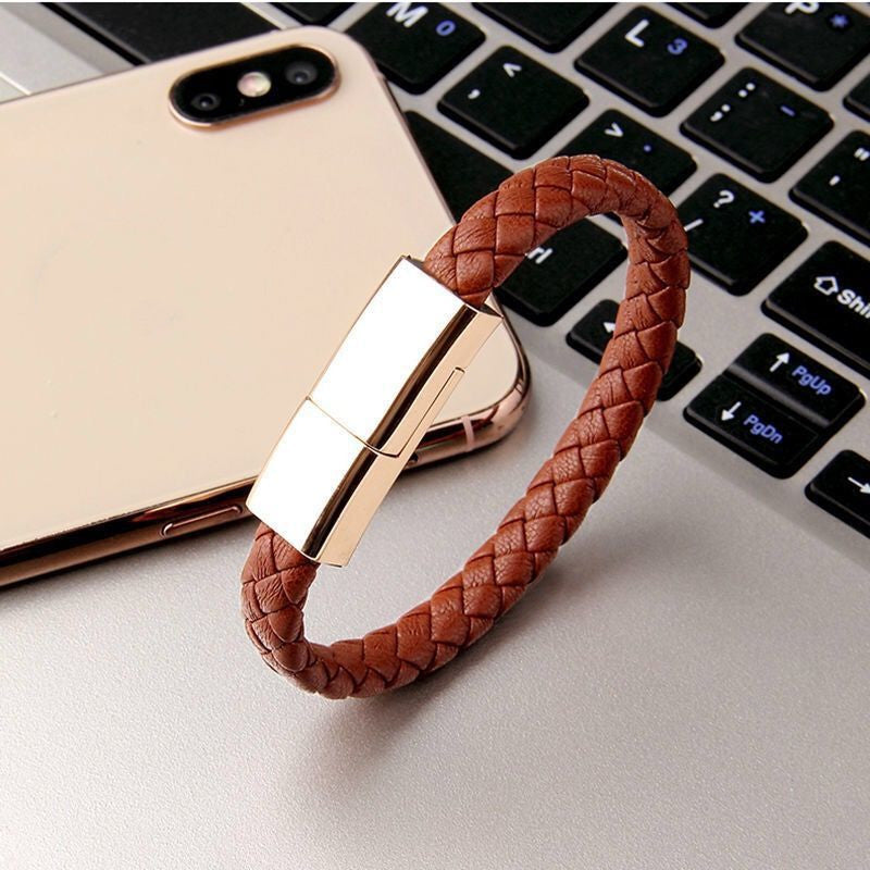 Braided bracelet charging cord charging a phone