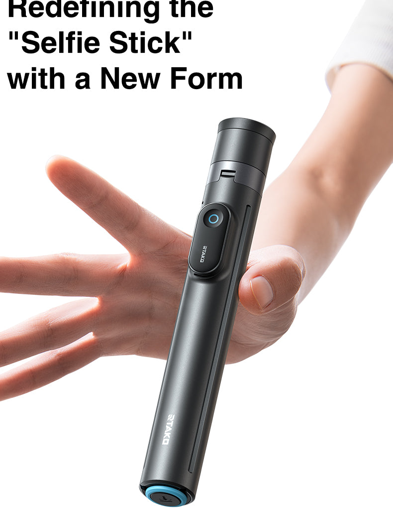Compact folded selfie stick held in hand showing portable size